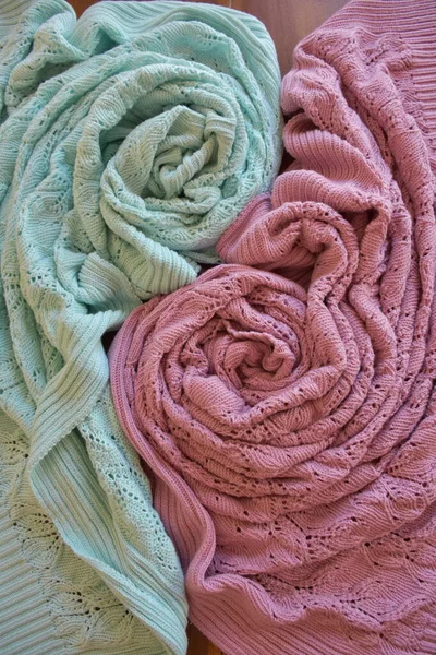 knitted fabric and blanket on background