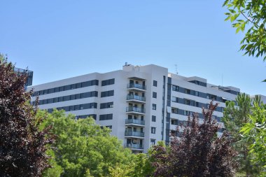 modern residential house in the city, trees and blue sky