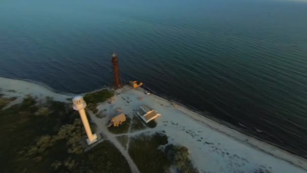 FPV Racing Drone Aerial Shot of Dzharylgach Island at Sunset time. A wide coastline, Plenty of Lakes, an old and new lighthouse, and a Black Sea — Stock Video