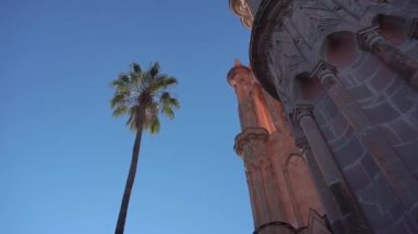 Smooth Gimbal Footage of great Parroquia de San Miguel Arcangel pink sandstone church in San Miguel de Allende, Mexico. High quality FullHD footage