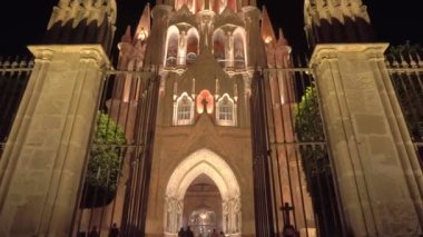 Smooth Gimbal Footage of great Parroquia de San Miguel Arcangel pink sandstone church in San Miguel de Allende, Mexico at night. High quality FullHD footage