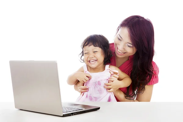 Happy family with laptop Stock Image