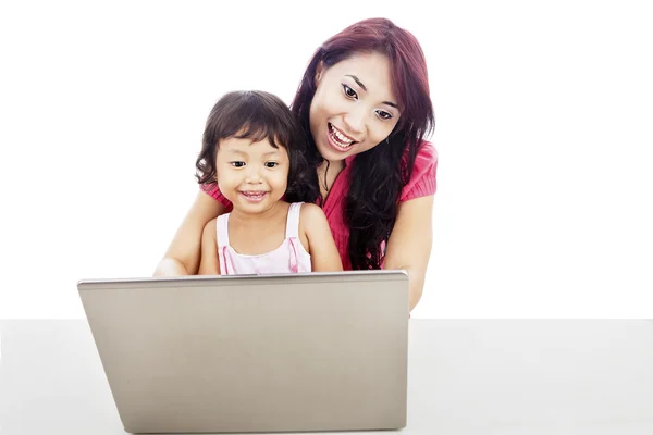 A mother accompany her child to use internet Royalty Free Stock Images
