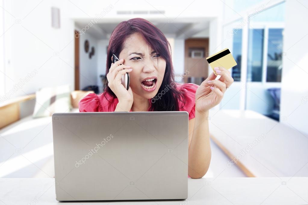 Disappointed woman shopping online