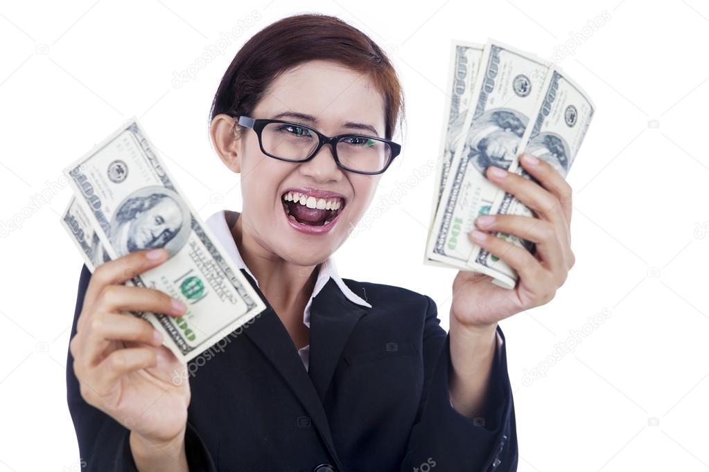 Businesswoman holding dollar bills