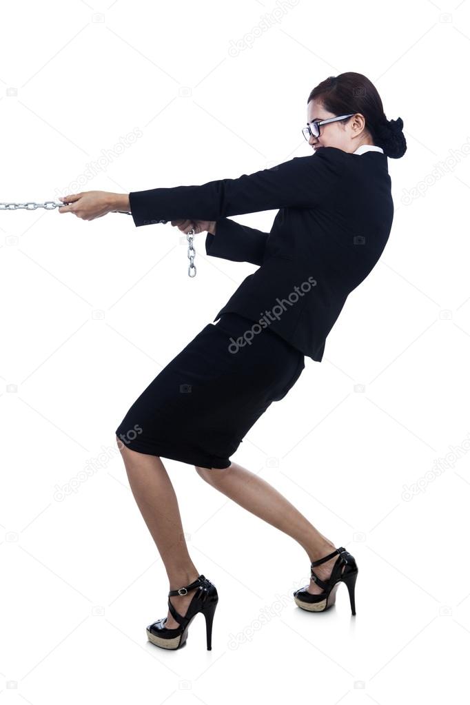 Businesswomanstrengthpullingchain — Stock Photo © realinemedia