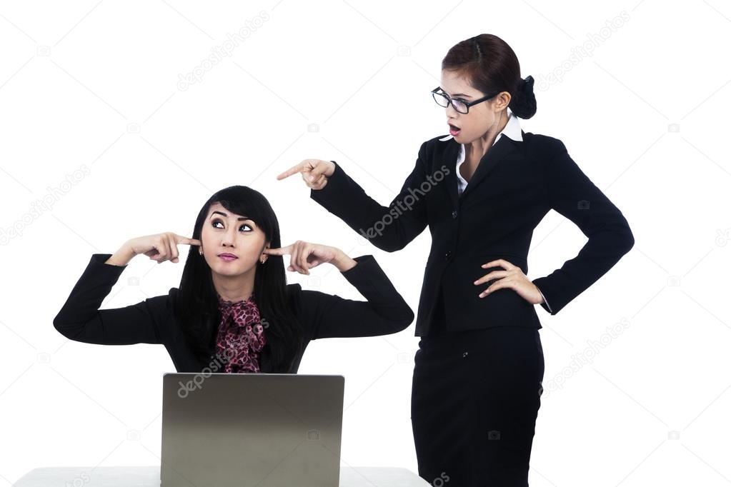 Business woman yelling at employee