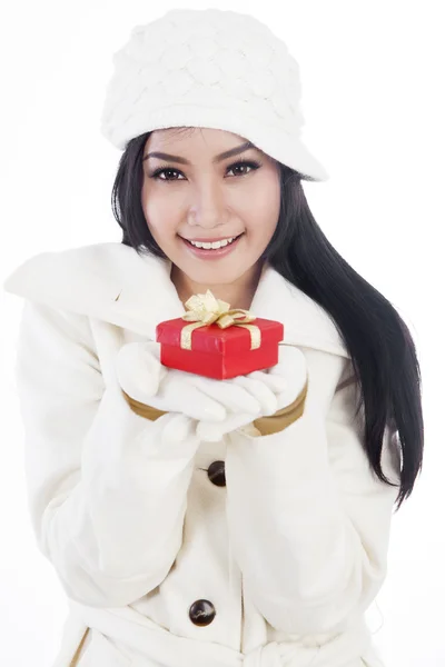 Beautiful woman giving a christmas gift — Stock Photo, Image