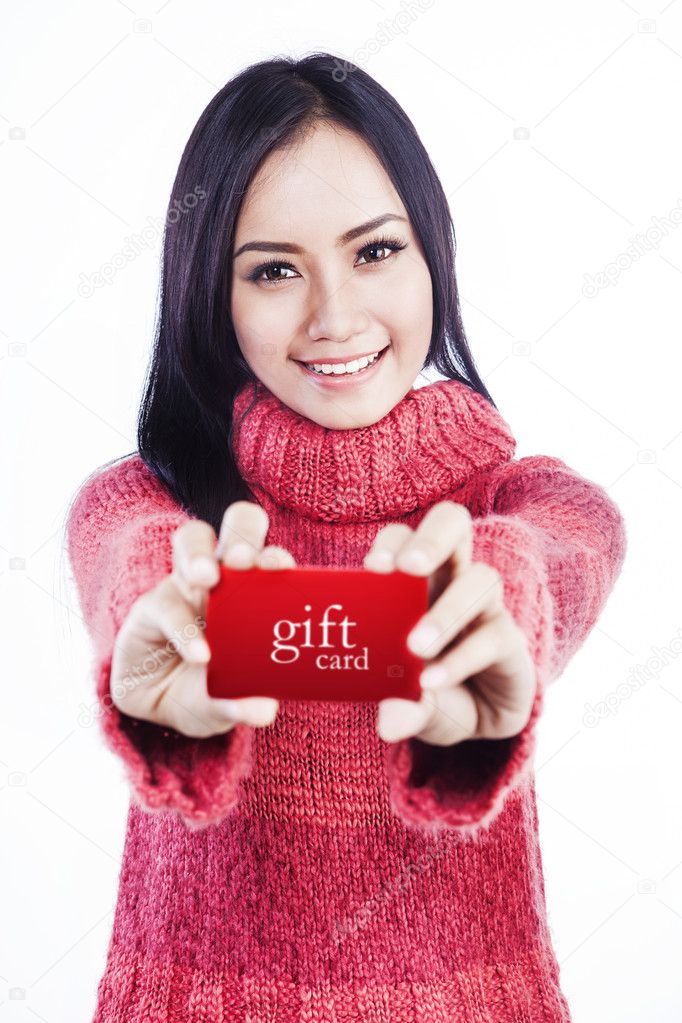 Excited woman showing gift card