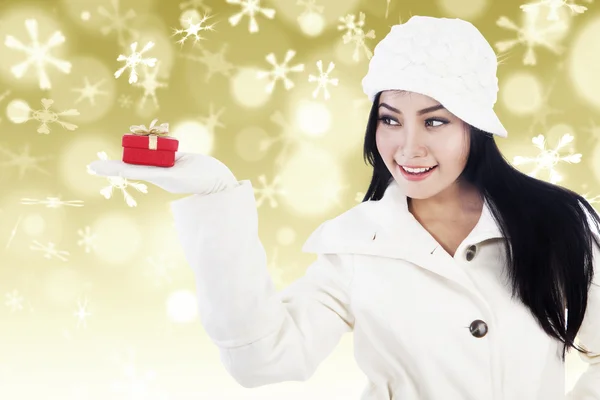 Christmas luxury gift hold by beautiful woman in white — Stock Photo, Image