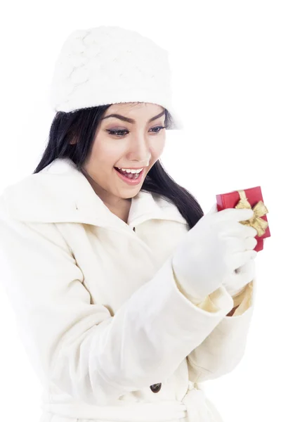 Beautiful young girl receives a gift — Stock Photo, Image