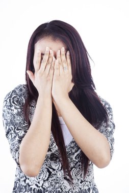 Cover face photo of woman isolated over white