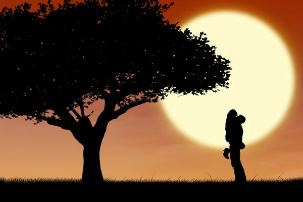 Couple câlin par un arbre sur silhouette orange coucher de soleil — Photo