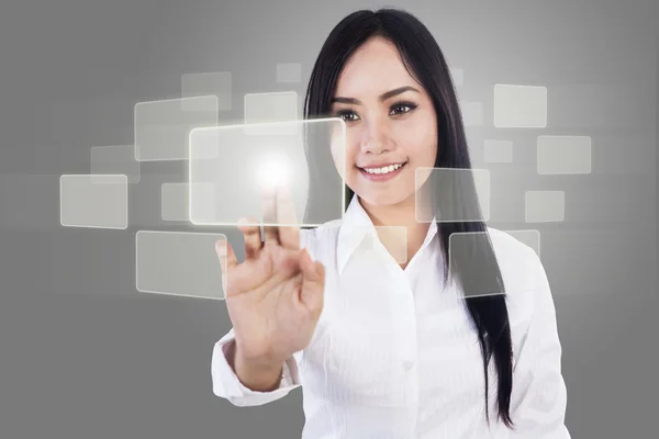 Beautiful businesswoman and touch screen — Stock Photo, Image