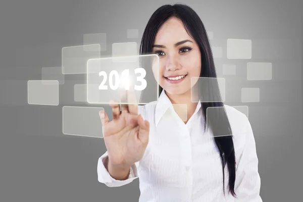 Businesswoman touch screen 2013 — Stock Photo, Image