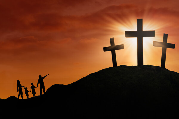 Family silhouette at the Cross