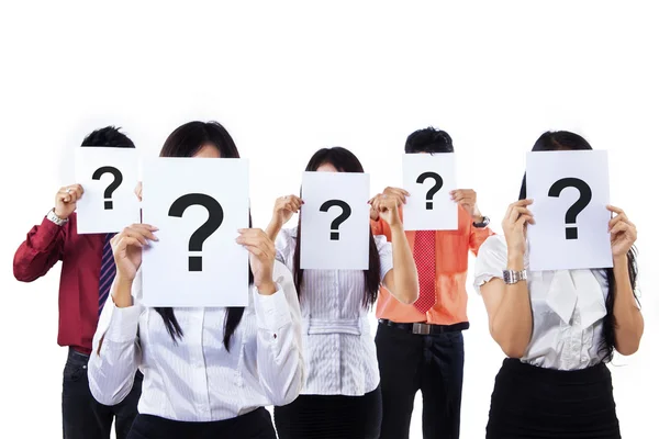 Colleagues holding question mark signs — Stock Photo, Image