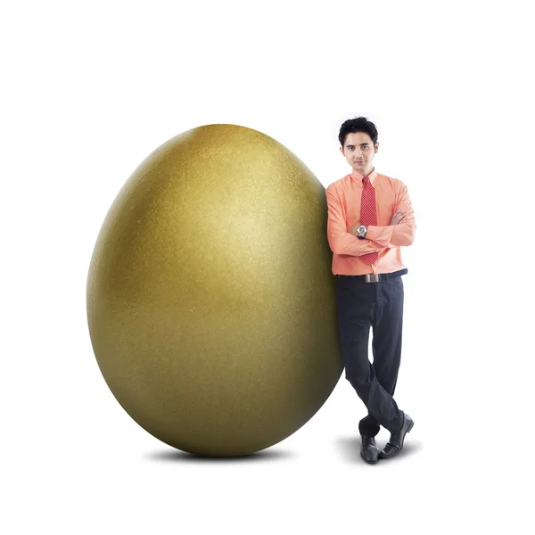 Businessman and big golden egg - isolated — Stock Photo, Image