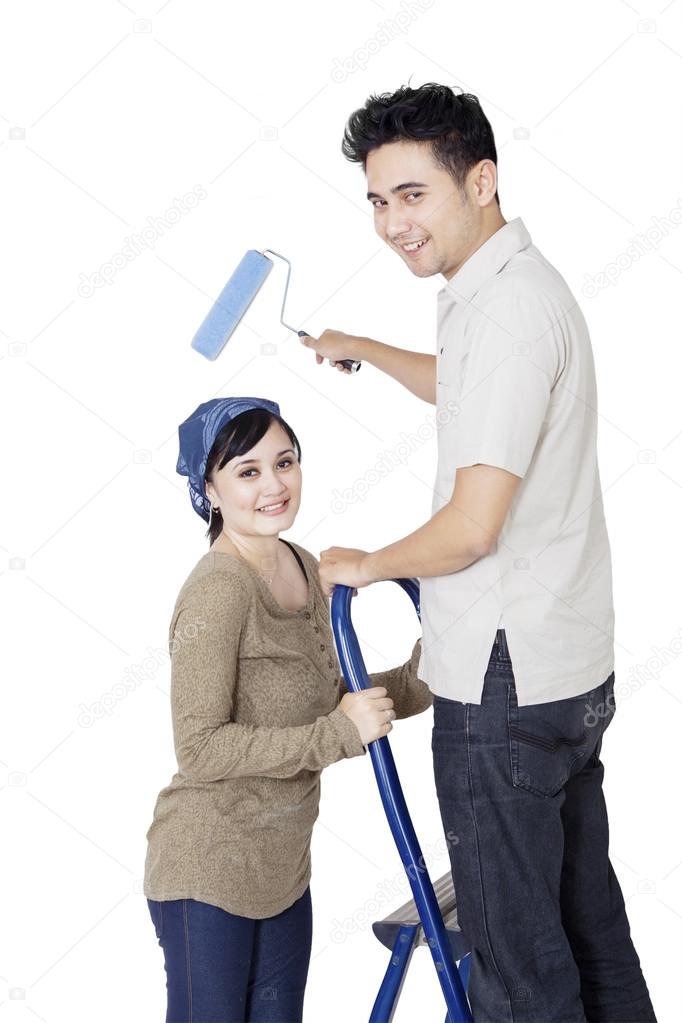 Cleaning couple after moving home