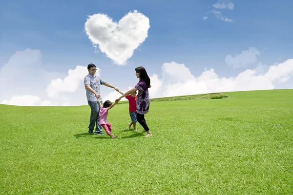 Dancing under love clouds Royalty Free Stock Photos