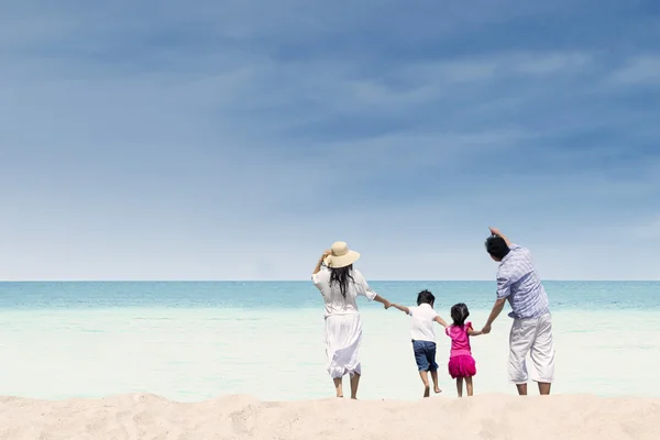 Happy family at white sand beach, Australia
