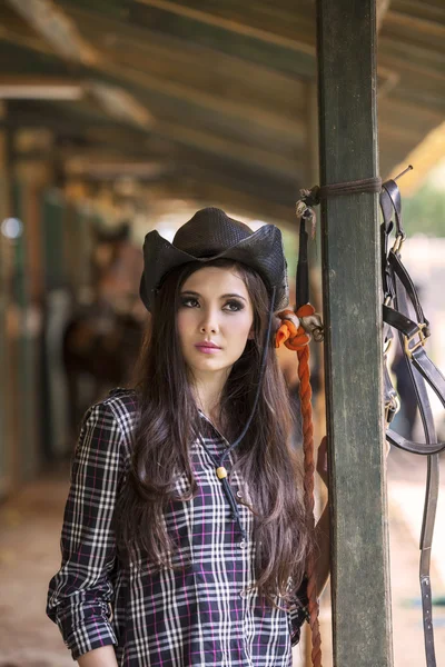 Attractive woman at horse ranch