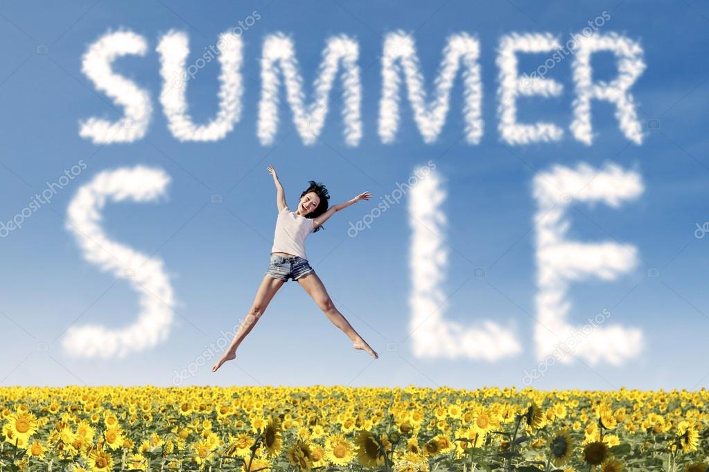 Summer sale clouds and woman jumping over sunflowers