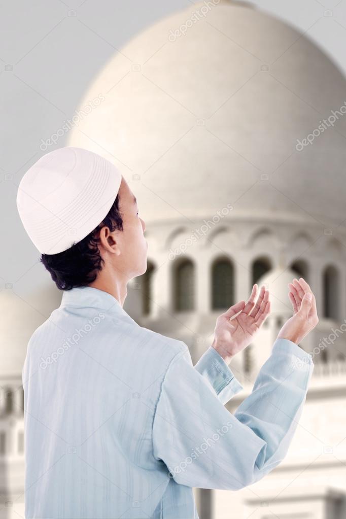 Boy muslim praying at mosque