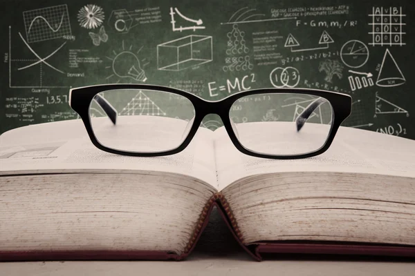 Book and glasses in class — Stock Photo, Image