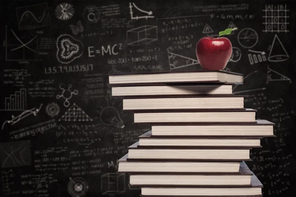 Apple and education books in class — Stock Photo, Image