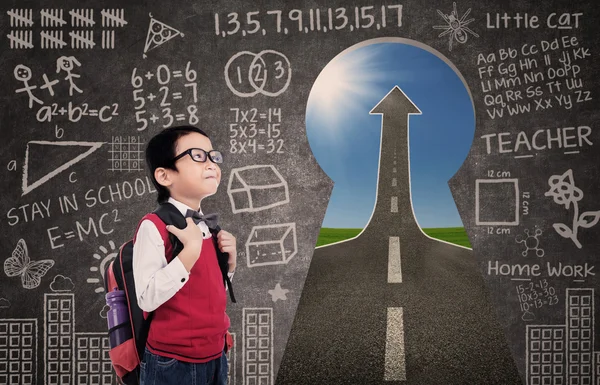 Boy standing in class with success road — Stock Photo, Image