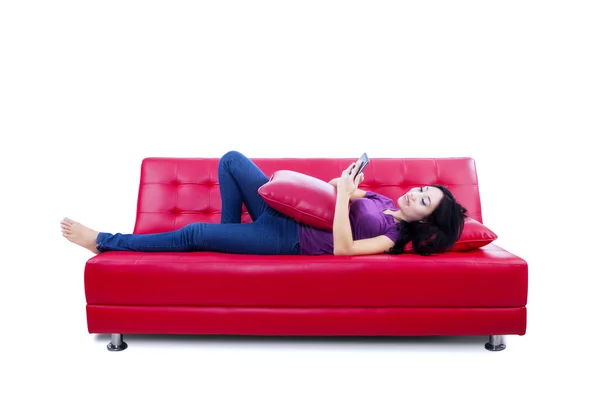 Attractive female reading e-book - isolated — Stock Photo, Image