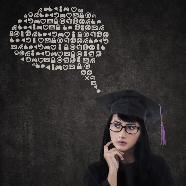 Pensive graduate with abstract cloud — Stock Photo, Image