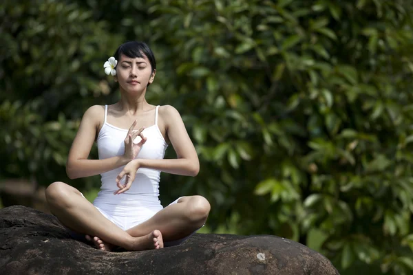 Woman sitting with Yoga style in Bali — Stock Photo, Image