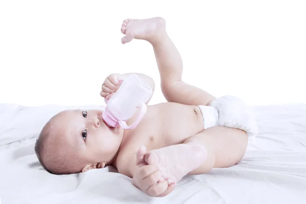 Cute baby gesture drinking milk — Stock Photo, Image