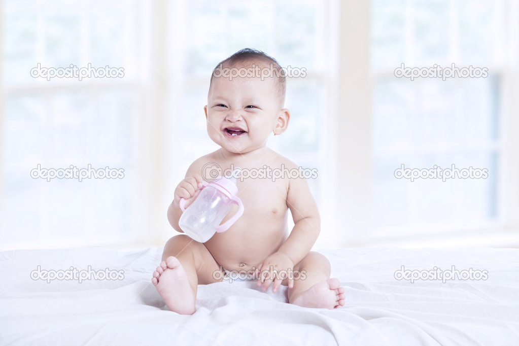 baby with milk bottle