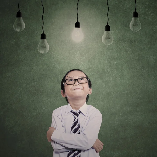 Close-up young businessman under lamps — Stock Photo, Image