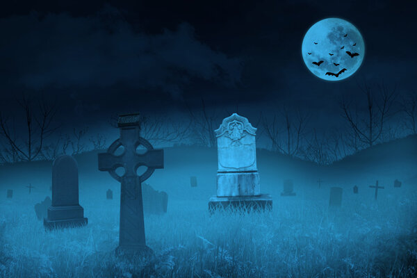 Ghostly graveyard under blue full moon for halloween background