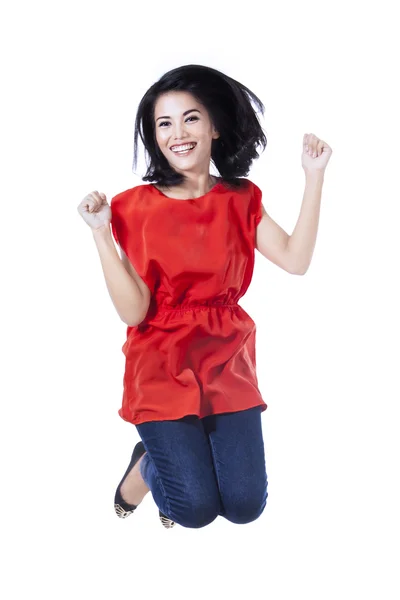 Excited young woman jumping — Stock Photo, Image