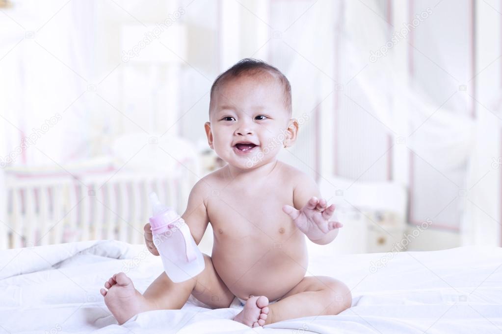 Baby with a milk bottle