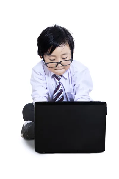 Cute little boy using laptop — Stock Photo, Image