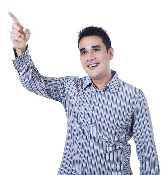 Smiling asian man pointing at something — Stock Photo, Image