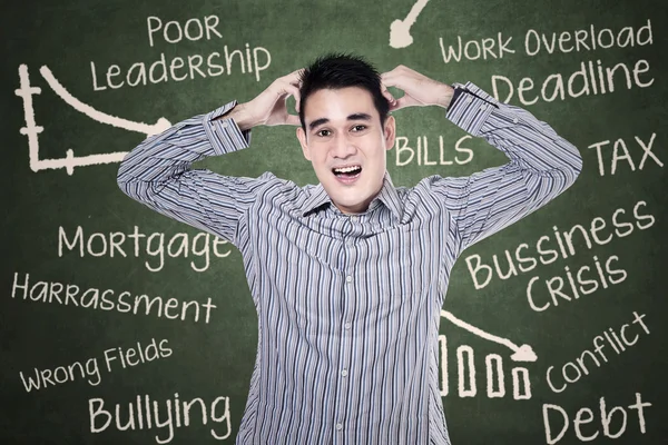 Stressed man at classroom — Stock Photo, Image