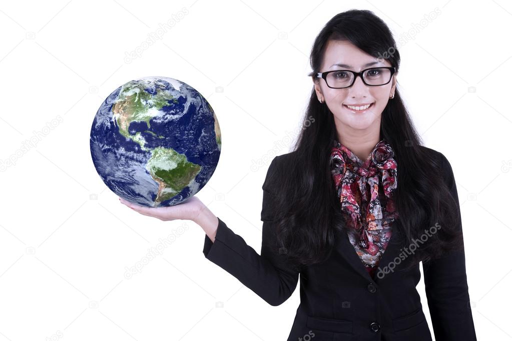 Businesswoman hold globe on white