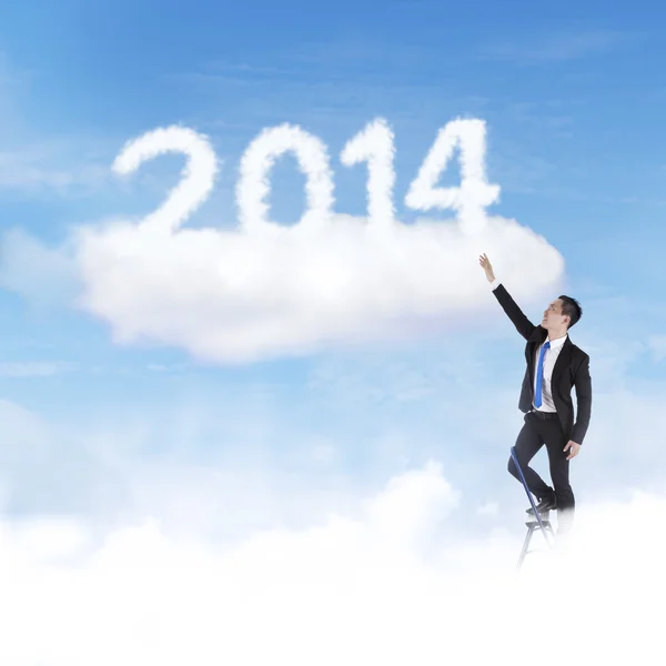 Zakenman omhoog klimmen tot 2014 — Stockfoto