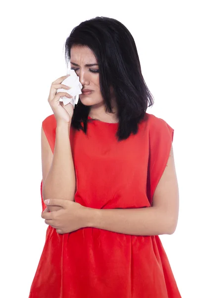 Beautiful woman is crying and holding handkerchief — Stock Photo, Image