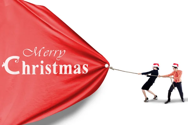 Business team pull christmas banner — Stock Photo, Image