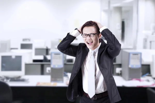 Angry businessman shouting at office — Stock Photo, Image