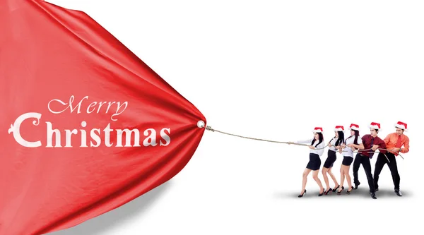 Businesspeople is pulling christmas banner isolated — Stock Photo, Image