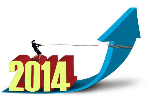 Businesswoman pulls the new year 2014 on the arrow up — Stock Photo, Image